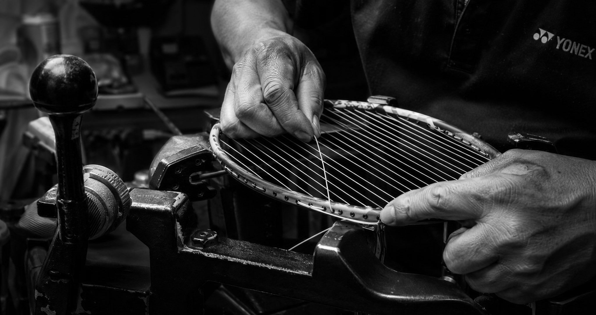 A racquet on the stringing machine in the ShuttleYard workshop